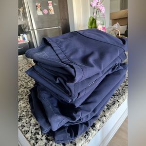 Four sets of FIGS Scrubs (M Tops/ L Petite Bottoms)